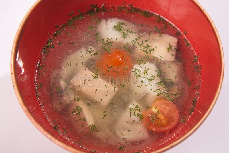 Fish soup in red plate