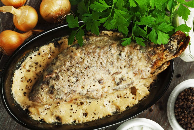 Fish in sour cream sauce stock photo. Image of sauce 101004782
