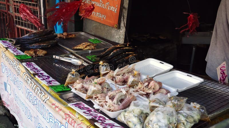 Fish Stall at a Street Food Market in Asia. Fresh Fish and Shrimp on