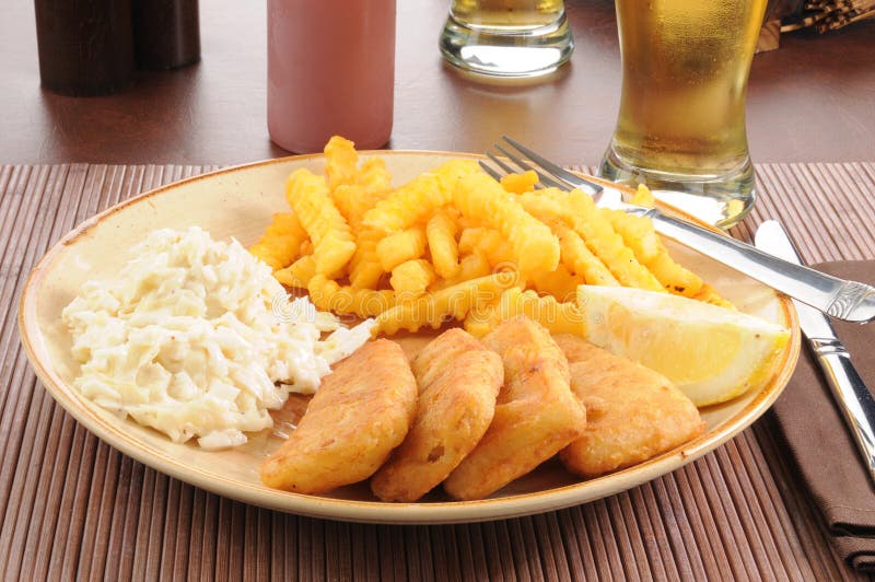 Fish sticks with coleslaw stock photography