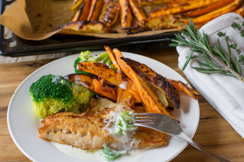 Fish with Sweet Potatoes and Vegetable Stock Photo - Image of cream