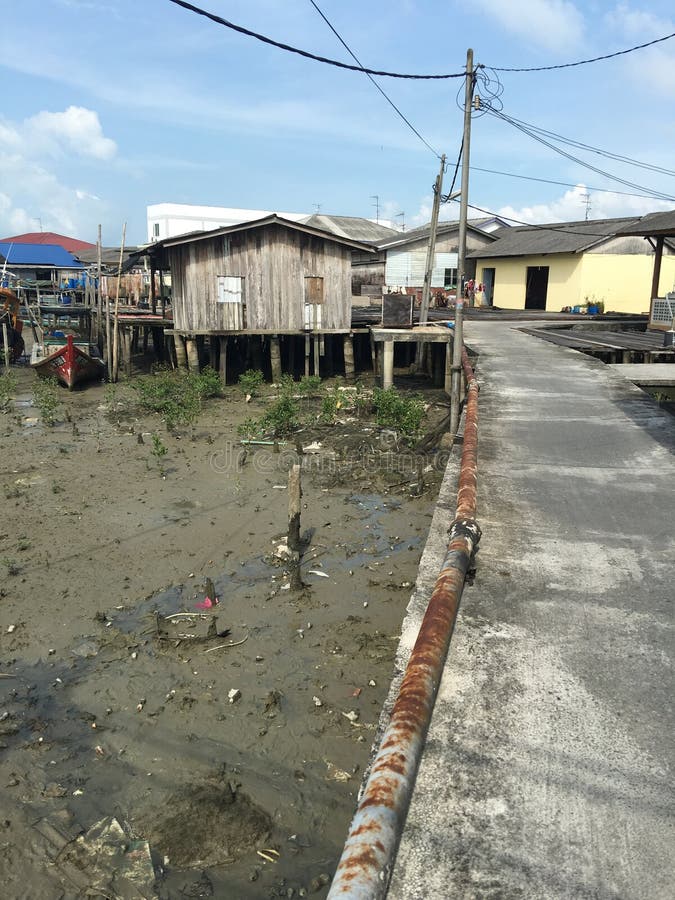 Walking ard the fish village that had converted to resort. The houses are elevated as high tide may come in. There are many mudskippers in the mud. Walking ard the fish village that had converted to resort. The houses are elevated as high tide may come in. There are many mudskippers in the mud