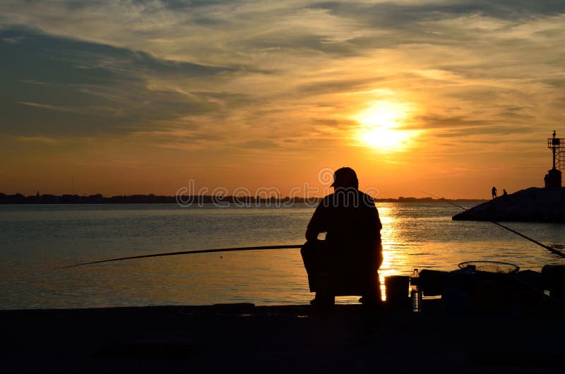 Fisher on the pier