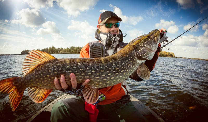 Fishing backgrounds. Fisherman and big trophy Pike.