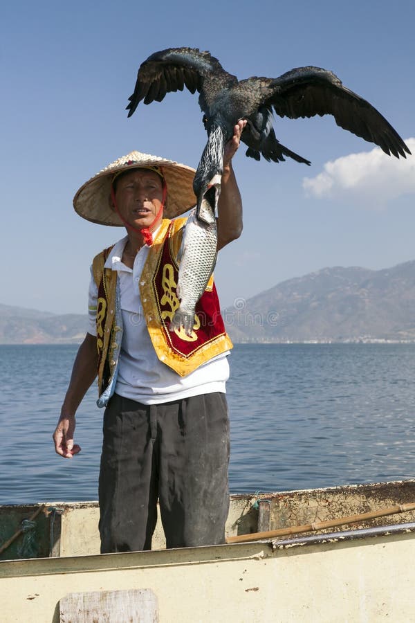 Fisherman with Bird and Fish royalty free stock photo Fisherman with Bird and Fish royalty free stock photo