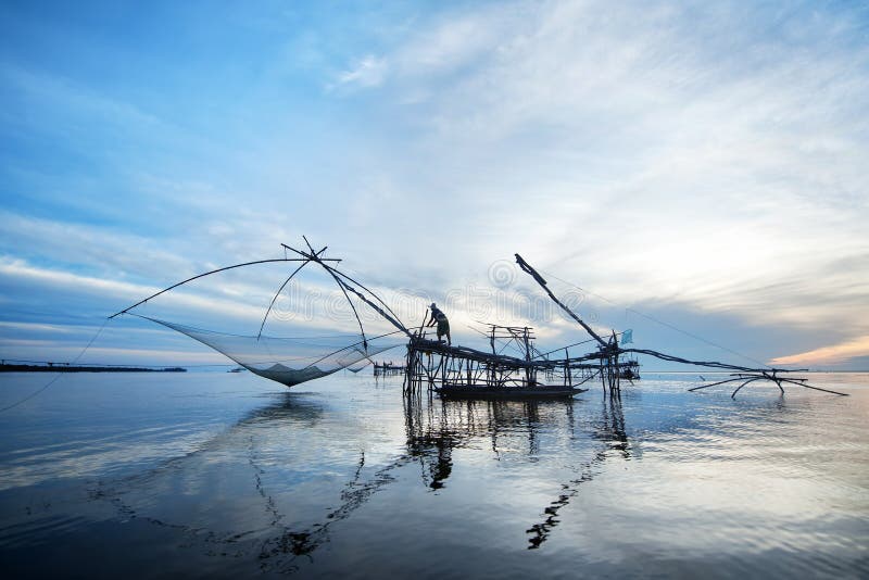 Fisherman in blue morning