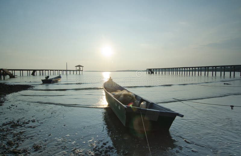 Fisherman boat left alone before sunset