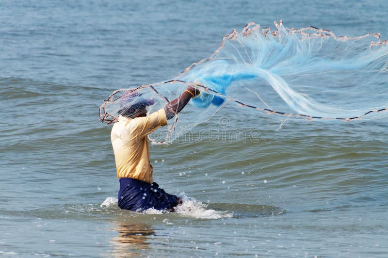 Fisherman catch fish editorial photography. Image of fishing