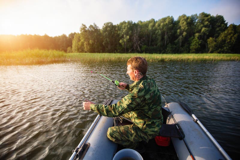 Fisherman Catching Fish on the River from Rubber Boat. Hobby. Stock Image Image of male, catch