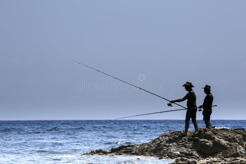 Fisherman fishing on the coast of Sardinia