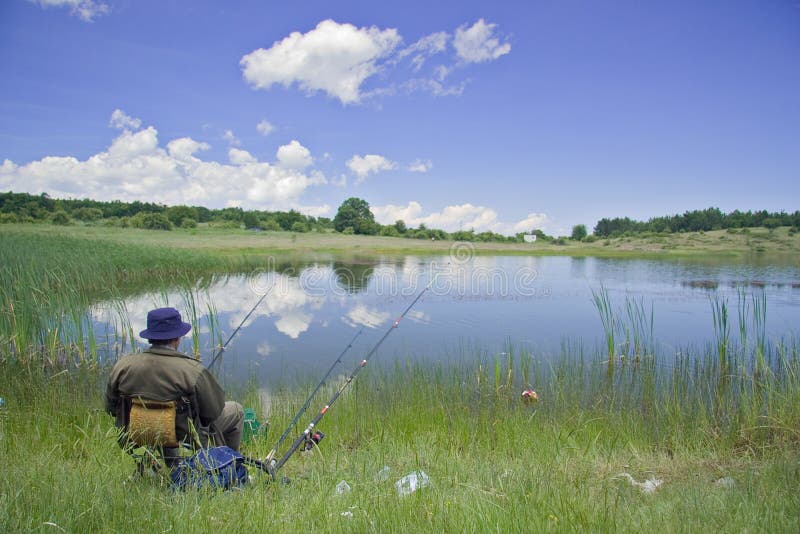 Fisherman on the lake shore royalty free stock photography Fisherman on the lake shore royalty free stock photography