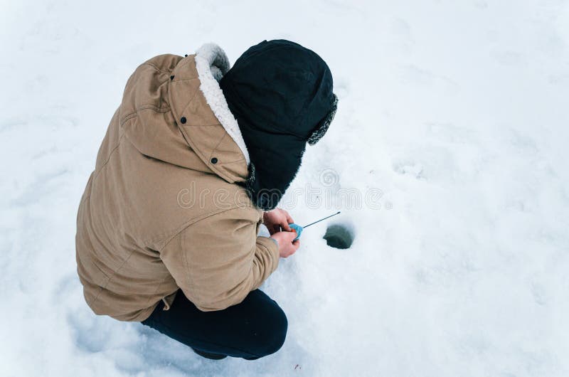 automatic fisherman ice fishing closeup automatic fisherman ice fishing closeup