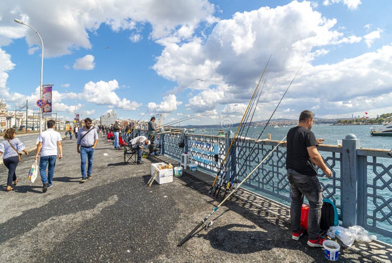 Fisherman with rods fish from the Galata Bridge over the Bosphorus River in Istanbul, Turkey. royalty free stock image Fisherman with rods fish from the Galata Bridge over the Bosphorus River in Istanbul, Turkey. royalty free stock image