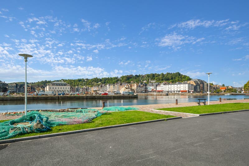 A fisherman`s net lies on a small stretch of park across the port from the fishing village of Honfleur France in the Normandy Regi royalty free stock photos A fisherman`s net lies on a small stretch of park across the port from the fishing village of Honfleur France in the Normandy Regi royalty free stock photos