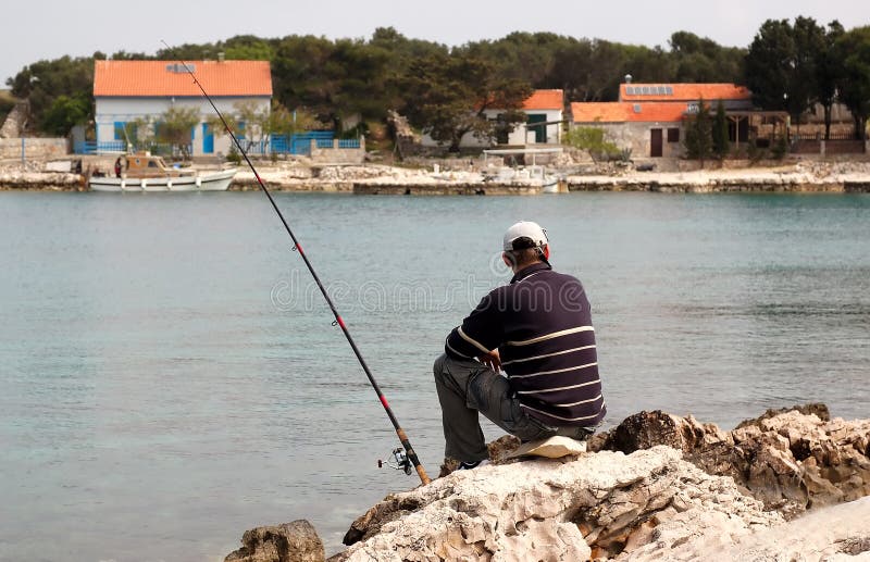 Fisherman at sea fishing