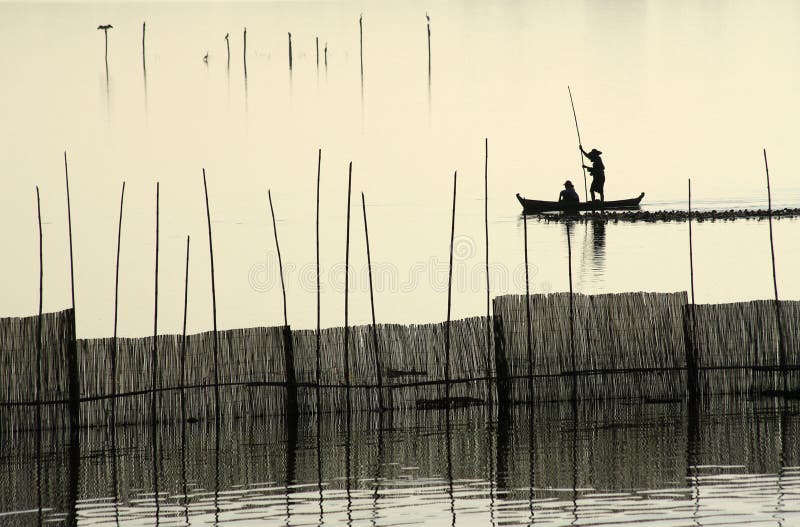 A fisherman silhouette near U Bein s Bridge.