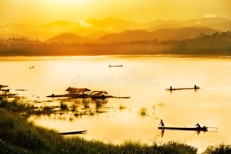 Fisherman in sunset background