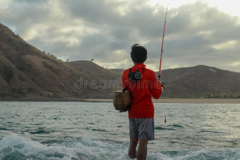Fishermen Catch Fish at Low Tide. View from the Back of Guy with Fishing  Rods in the Water Stock Image - Image of catch, reel: 196136271