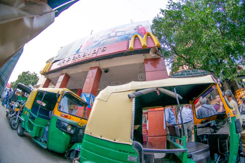 fisheye shot of chandni chowk with auto and electric rickshaw and fast food joint stock images fisheye shot of chandni chowk with auto and electric rickshaw and fast food joint stock images