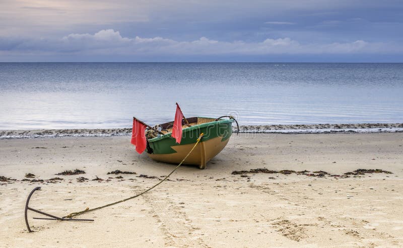 Fishing boat with anchor and flags