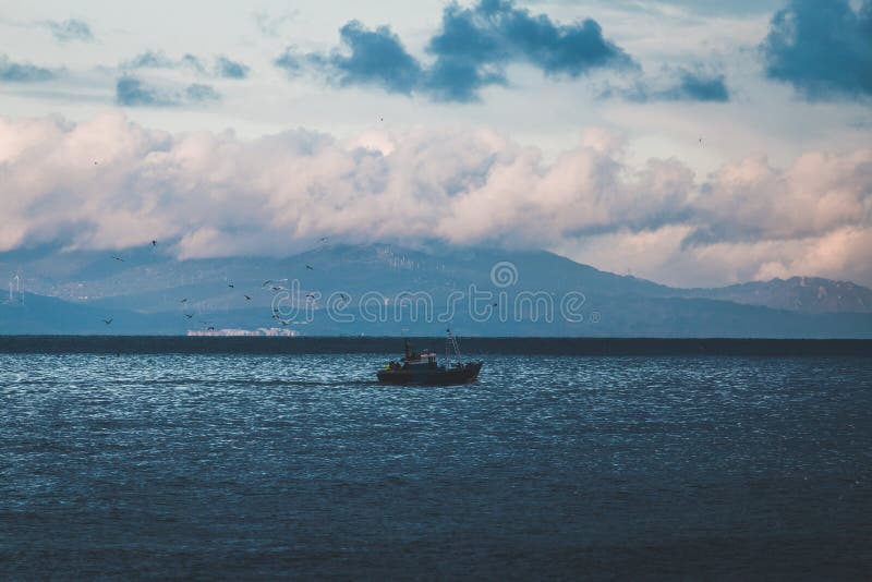 Fishing Boat In The Sea Under The Clouds Stock Photo Image Of Tangier Cold Fishing Boat In The Sea Under The Clouds Stock Photo Image Of Tangier Cold