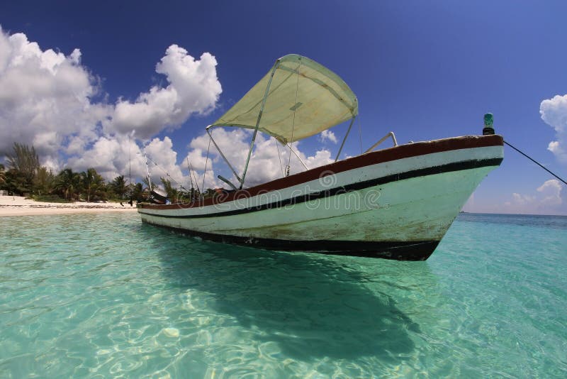 Fishing boat on tropical caribbean beach