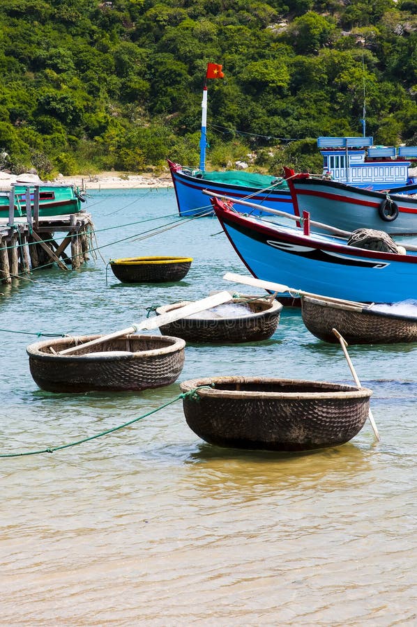 Fishing boats and coracles in the bay