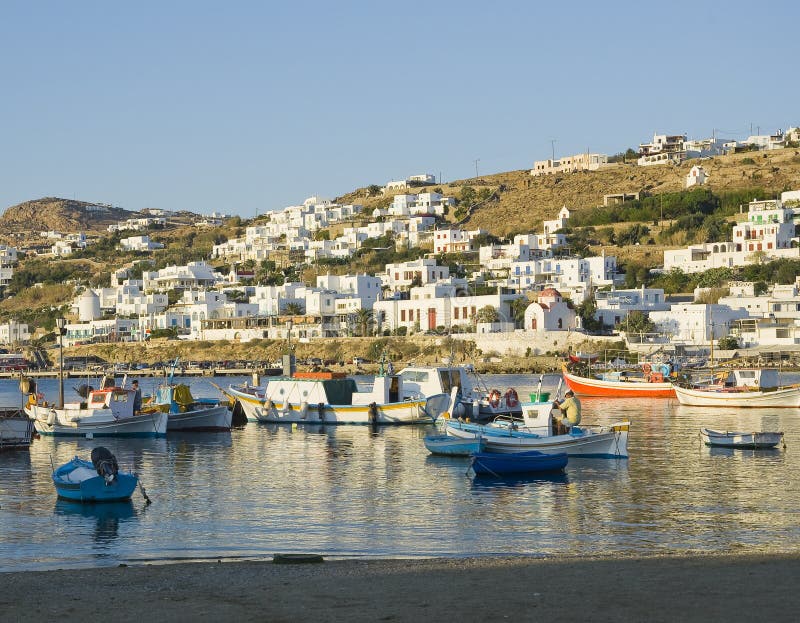 Fishing boats in the harbor of Mykonos at sunset