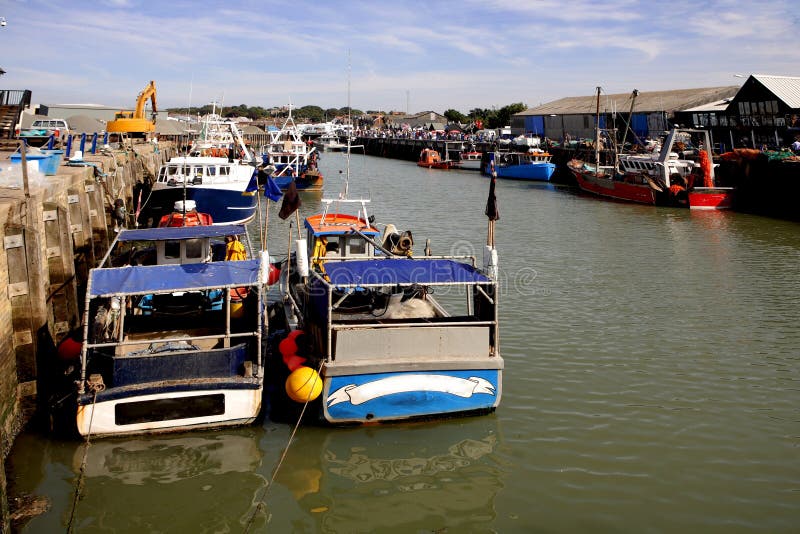 Fishing boats in the harbour at Whitstable royalty free stock image