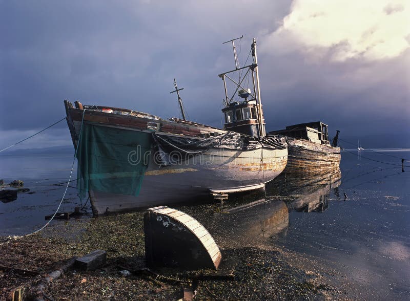 Fishing boats after storm stock photography