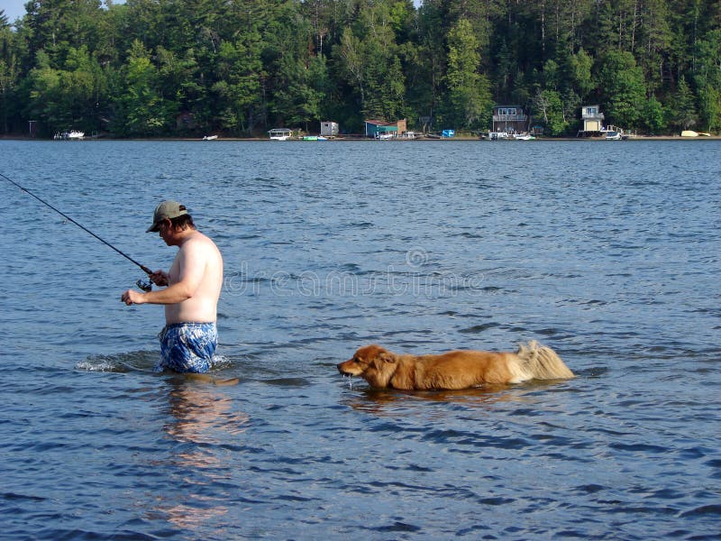 Fishing with the dog stock image. Image of puppy, freshwater 3360295