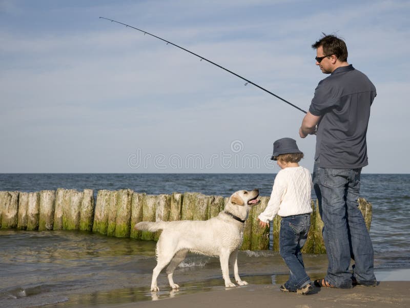 Fishing with dog stock image