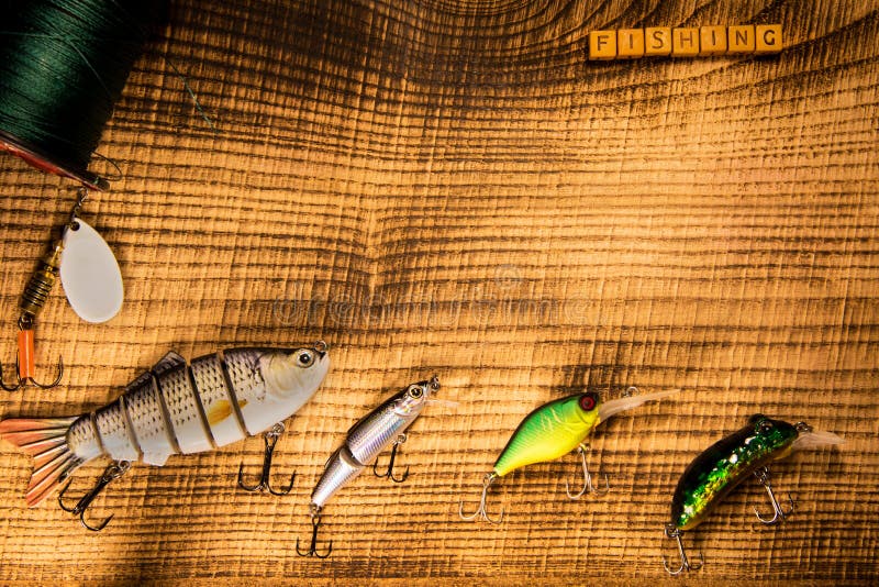 Fishing Gear, Artificial Bait on a Predator on a Wooden Background, Top  View Wobblers and Various Bait Cords and Tongs Stock Image - Image of  color, equipment: 109351661