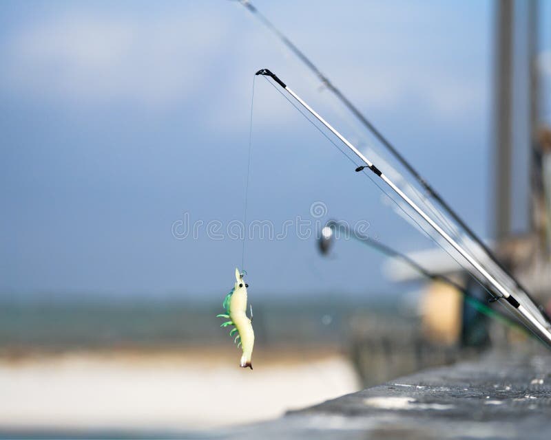 Fishing Lure on Pier with Beach in Background Stock Photo Image of