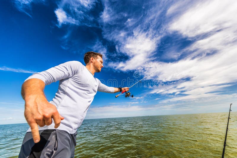 Fishing man in florida boat excursion tour throwing line with road fisherman in Everglases. Sports lifestyle