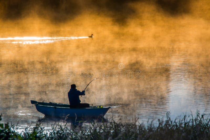 Fishing in a misty morning  man s hobby