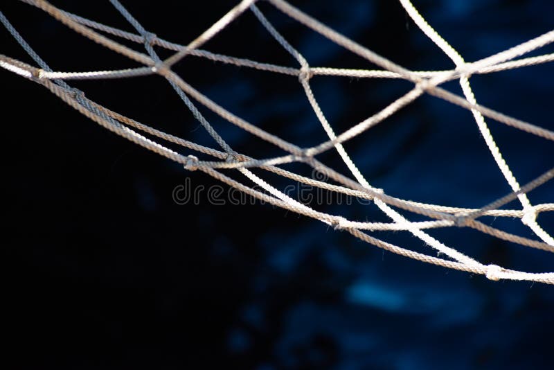Fishing Net and Blue Dark Water Surface, Soft Focus Stock Photo Image
