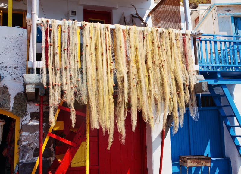 Fishing nets in Klima. Milos Island, Greece. Fishing nets hanging in the Village of Klima. Milos Island, Greece stock photo Fishing nets in Klima. Milos Island, Greece. Fishing nets hanging in the Village of Klima. Milos Island, Greece stock photo