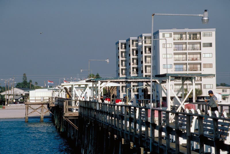 Fishing Pier with Hotels in Background Stock Image Image of structure