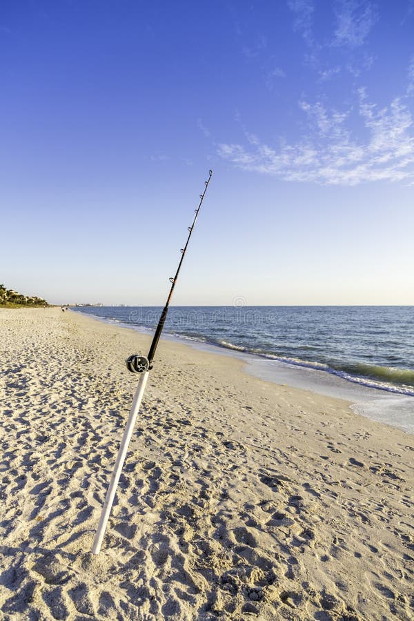 Fishing Pole and Canoe on the Beach Stock Image Image of canoe