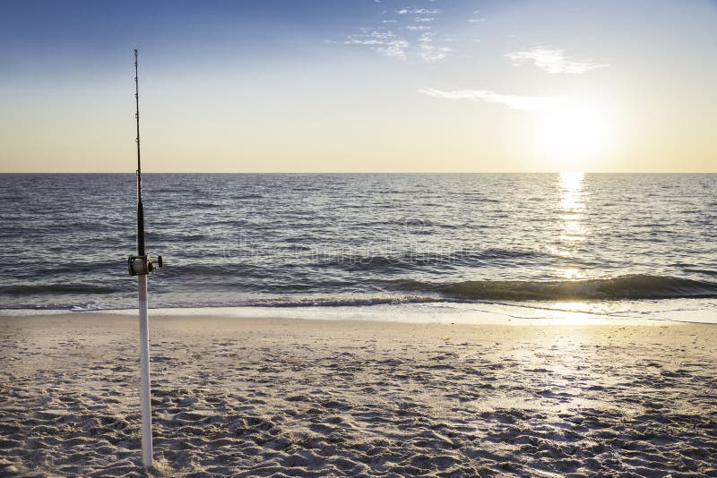 Fishing Pole and Canoe on the Beach Stock Image Image of canoe