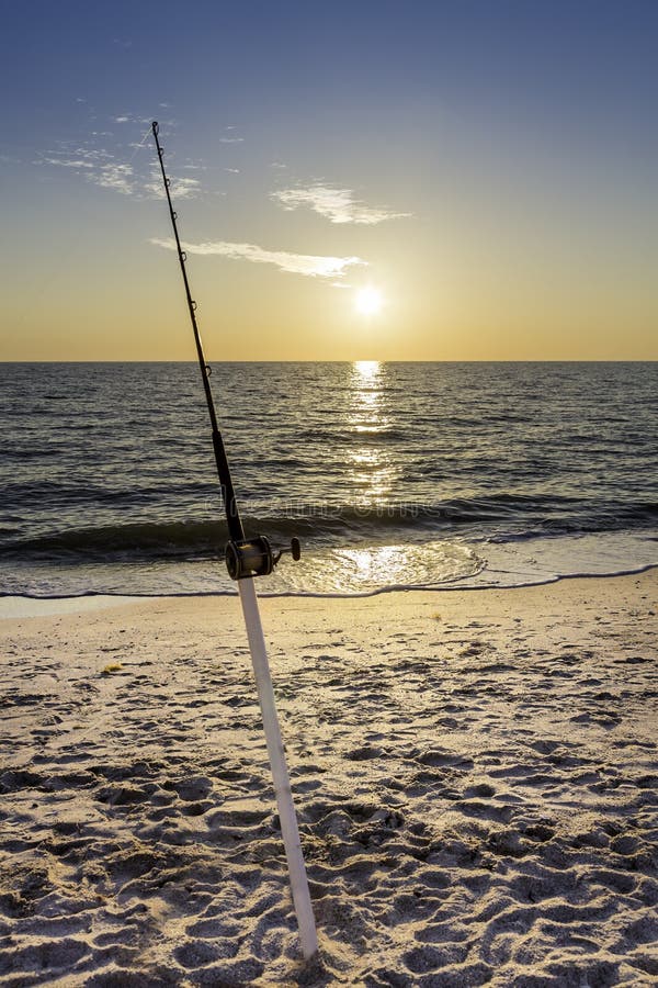 Fishing Pole and Canoe on the Beach Stock Image Image of canoe