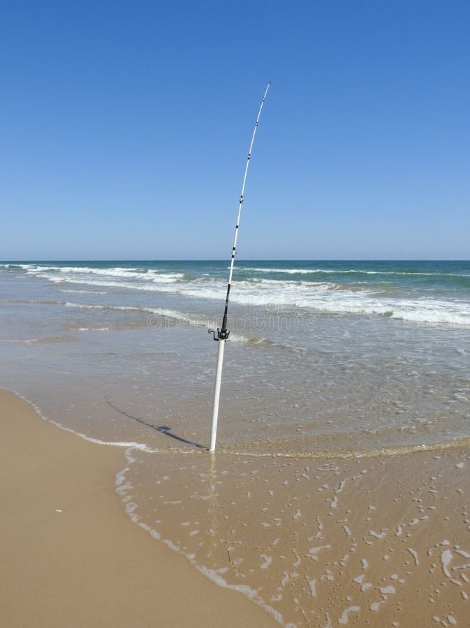 Fishing Pole on the Beach stock photo. Image of ocean - 240410208