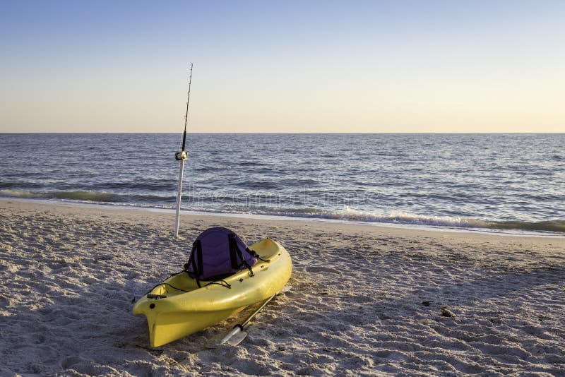 Fishing Pole and Canoe on the Beach Stock Image Image of canoe