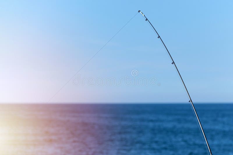 https://thumbs.dreamstime.com/b/fishing-rod-against-blue-ocean-sea-background-copy-space-waiting-biggest-haul-meditative-relax-sport-fishing-rod-against-159938473.jpg