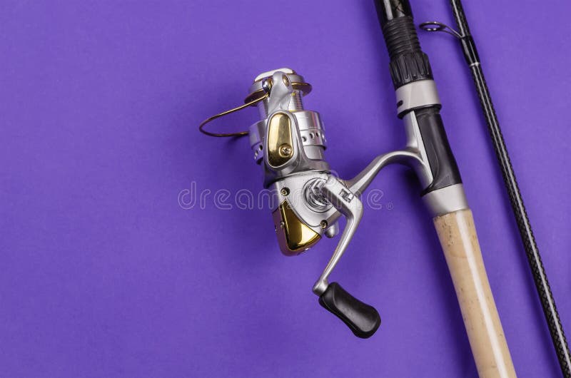Fishing Rod with Attached Fly Fishing Reel on Blue Background Stock Photo -  Image of fishing, focus: 209466544