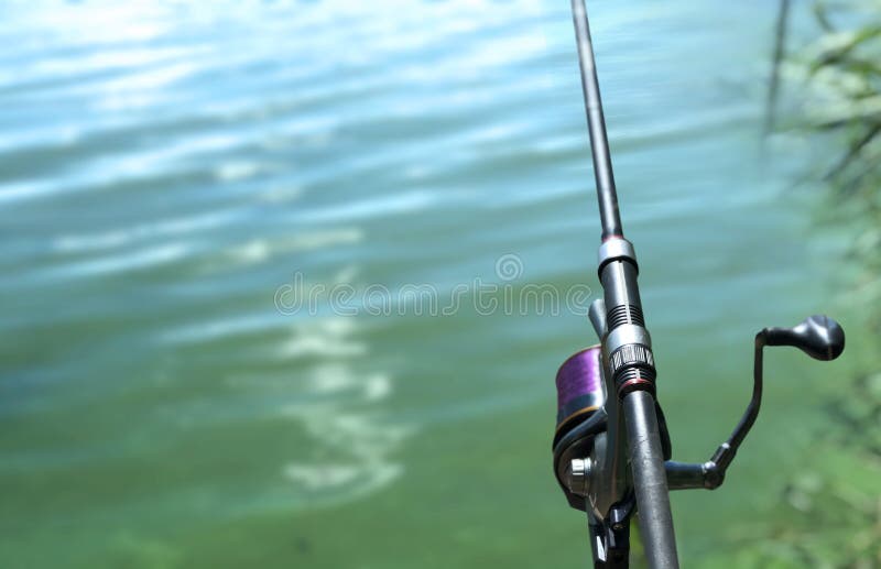 https://thumbs.dreamstime.com/b/fishing-rod-background-water-against-light-ripples-highlights-sports-carp-wildlife-out-town-rest-fish-day-195577114.jpg