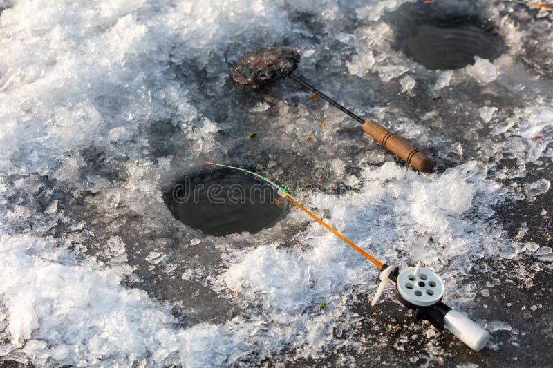 Fishing rod on ice in winter. Ice fishing stock images