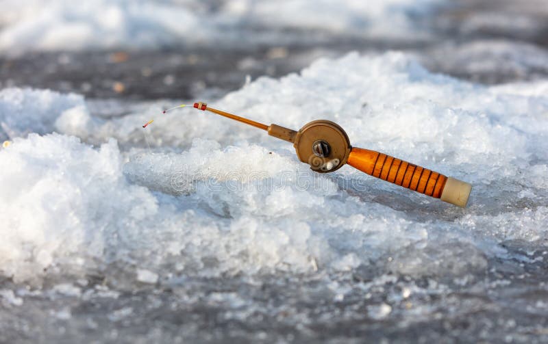 Fishing rod on ice in winter. Ice fishing royalty free stock photos