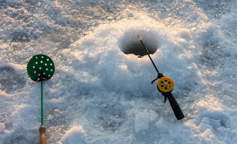 Fishing rod on ice in winter. Ice fishing stock images